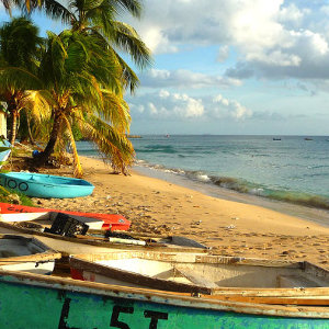 Fishing village beach location on Caribbean Island with wooden row boat props