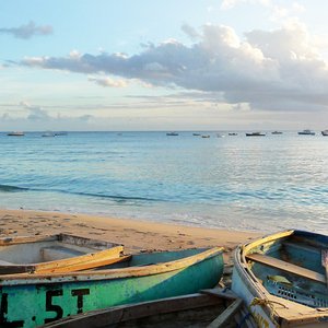 Fishing row boats on Caribbean sunset beach