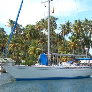 Sailboat with wooden deck on Caribbean palm island shooting location
