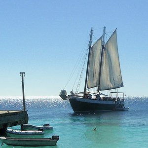 Schooner with white sails for photo shoot rentals on Caribbean sea location