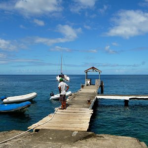 Weather beaten wooden jetty with hut on Caribbean pirates island of  St.Vincent