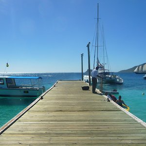Rustic wooden pier for Caribbean sailing boats