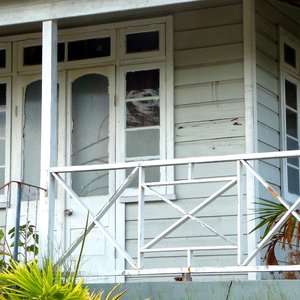 Small Caribbean wood house veranda with patina on location in Barbados