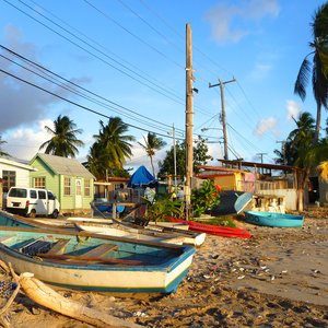 Fishing village with Caribbean wood houses along busy beach side street