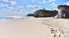 Long Flat White Bahamas Beach With Magnificently Shaped Massive Rocks