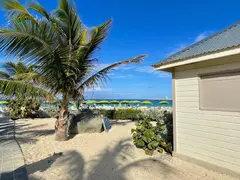 Long Beach Stretch In St Martin With Coconut Tree And Green Parasols
