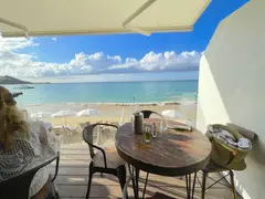 Beach Bar In Saint Martin Overlooking White Beach Parasols For Video Production