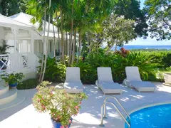 Colonial White Painted Wooden House With Porch On Pool Deck