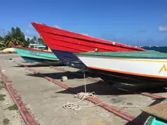 Colorful Fishing Boats Lined Up On Dry Dock On Grenadine Island