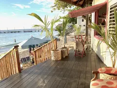 Colourful Lively Beach Bar With Stairs To Bthe Sea And Jetty As Backdrop In Photo Shooting
