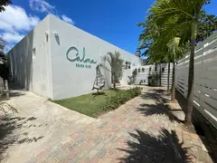 Modern Square Shaped White Beach Club Bar And Restaurant Entrance With Wooden Fence And Palm Tree