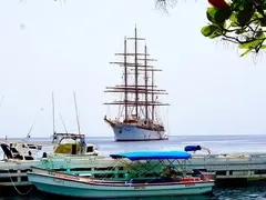Pier Construction Of Wood With Small Fishing Boats Water Taxi And The Elegant Three Master Cruise Ship Sea Cloud In St Lucia