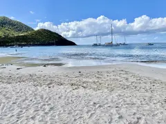 Powder White Sandy Beach On Caribbean Sea With Catamarans