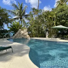 Pool Off Beach With Vast Veranda In Tropical Garden