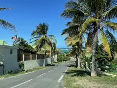 Road Leading Downhill Towards The Sea Lined With Palms And Stone Houses
