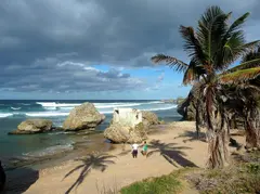 Rustic All Natural Beach Feel With Massive Rocks And Surfer Waves For Video Production