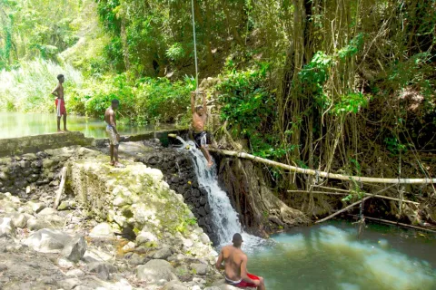 Waterfall In The Dense Jungle With Natural Swimming Pool
