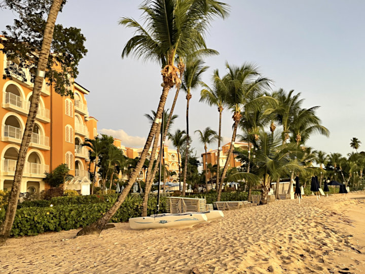 Elegant Barbados beach hotel with palm lined white sandy beach