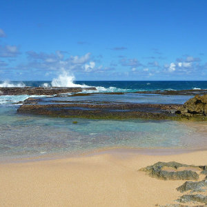 Caribbean geyser over rocks on Atlantic coast