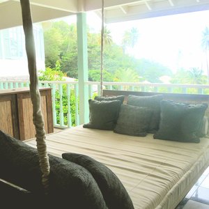 Coastal style day bed on Caribbean resort veranda