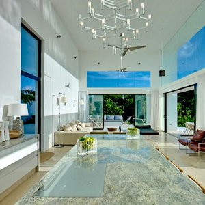 Modern white, steel, glass living room in the Caribbean