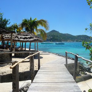Wooden Caribbean jetty along seaside on Grenadine island location