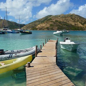 Wooden jetty on small deserted island location near St. Martin