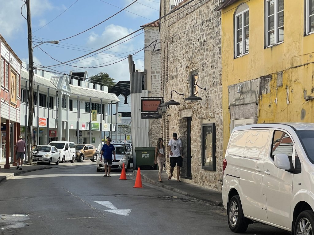 Busy small town with house walls built of coral stone