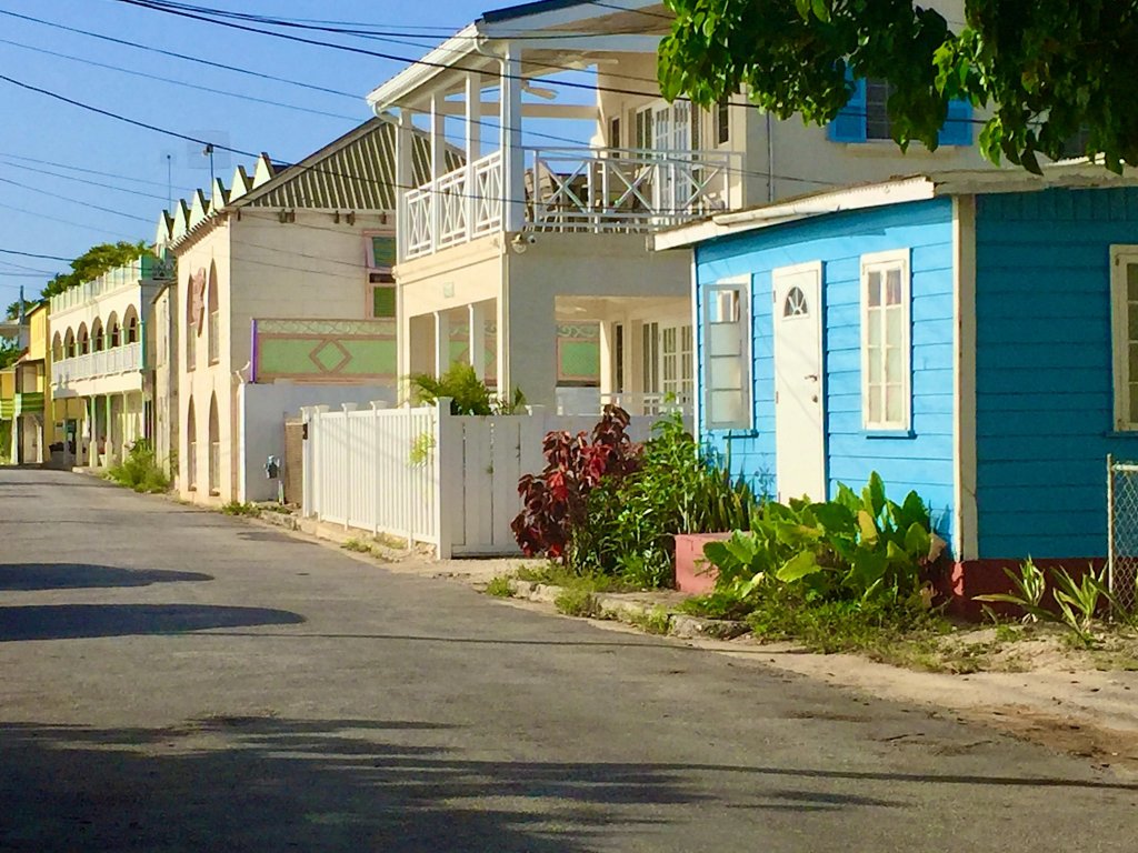 Pretty colourful houses with galleries facing the beach and the sea