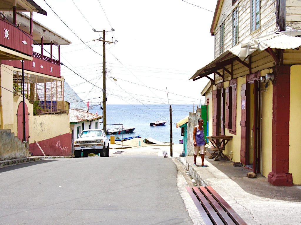 St lucia old fishing village with street leading down to the jetty